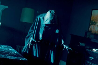A hooded wraith creeps in the dark in SurrealEstate 201.